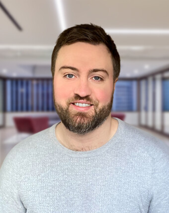 UK-audit-professional-standing-in-office